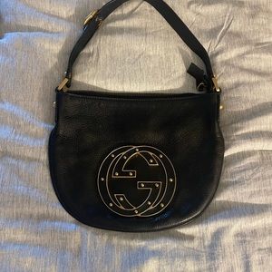 Gucci half moon shaped leather bag with gold hardware